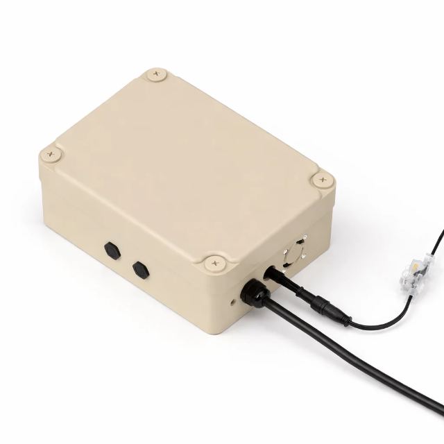 The 4-Channel Controller in a cream weatherproof enclosure, its output lead leaving the case