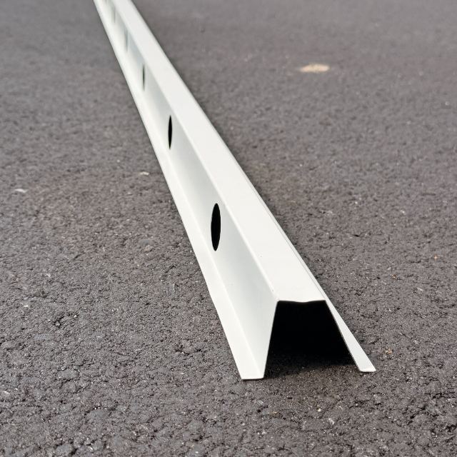 The same commercial track viewed end-on, showing the depth of the channel the lights seat into