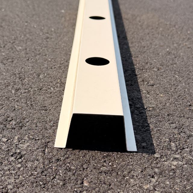 The 2-inch deep hat track in white aluminum, angled to show the channel and its mounting holes